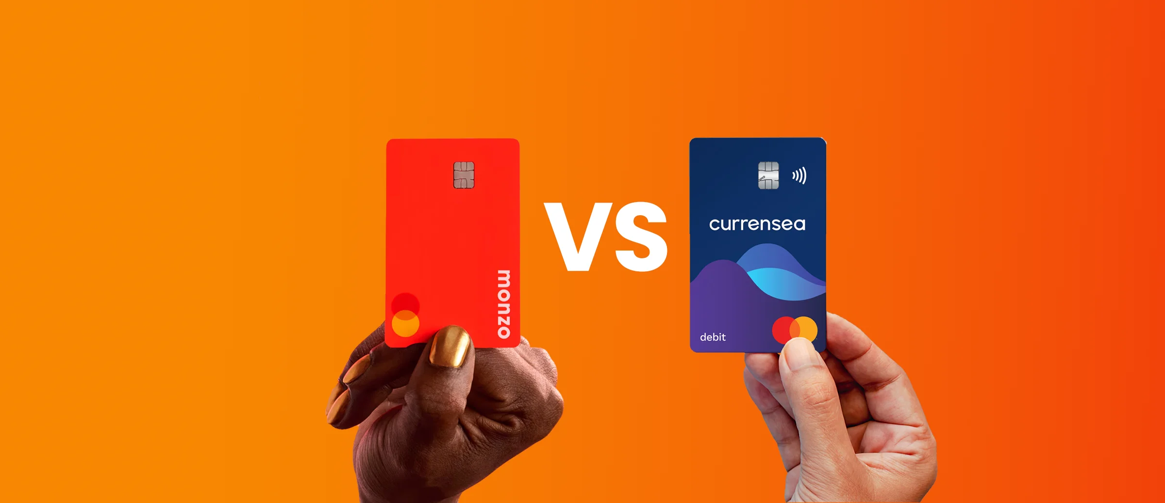 currency and monzo debit cards being held up with an orange-red background